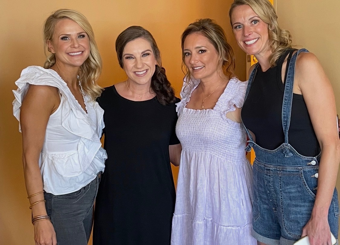 Women of the Orange Heart Collective at an event